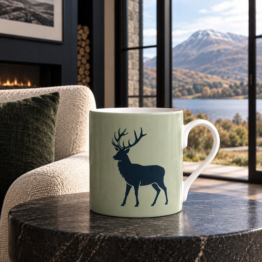Stag Silhouette fine bone china mug featuring a deep navy stag on a soft muted green ground