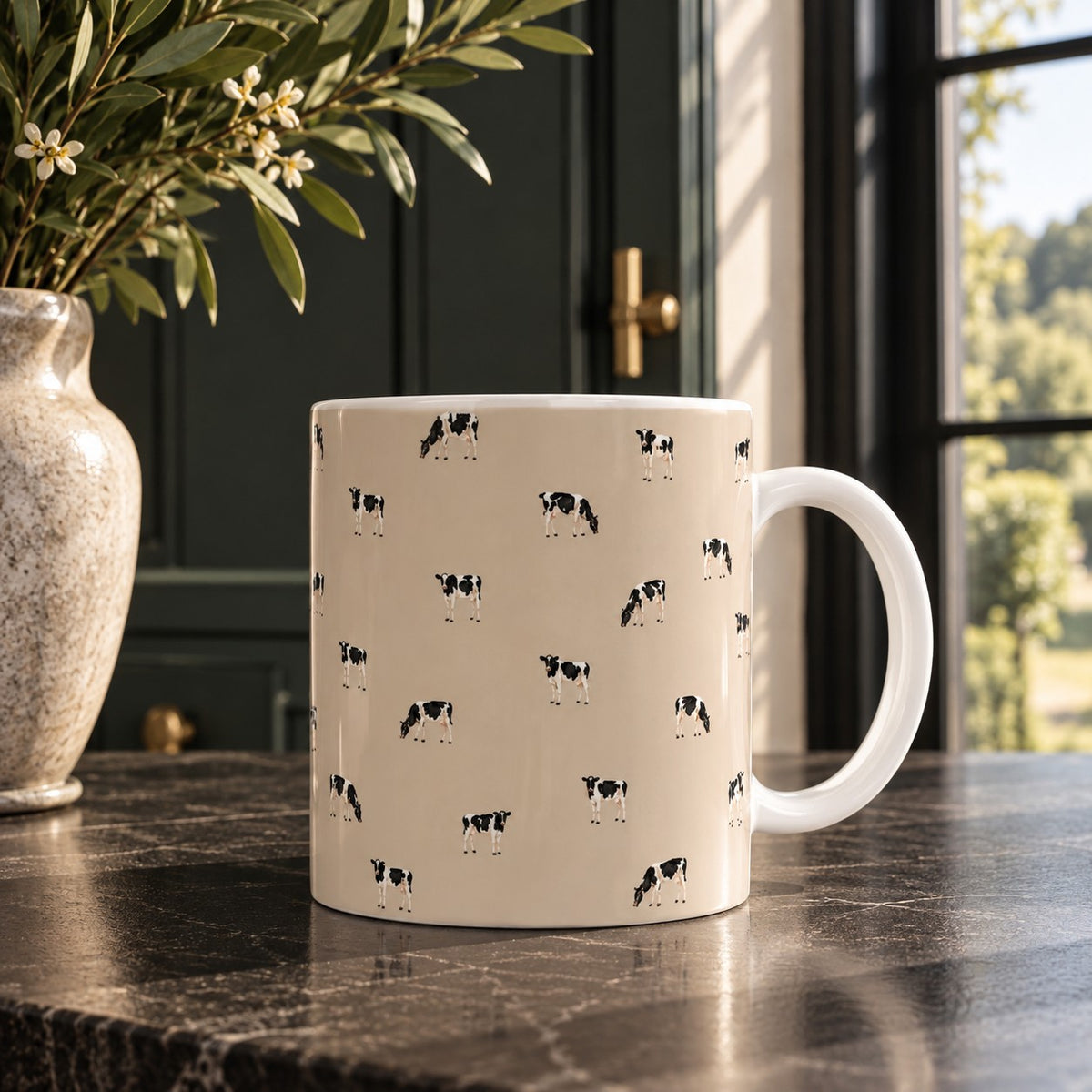 Farmyard Cows ceramic mug with illustrated black and white dairy cows standing and grazing on a soft warm neutral background