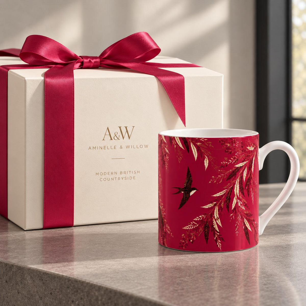 Crimson fine bone china mug featuring a dark bird in flight with sweeping cream and gold botanical foliage