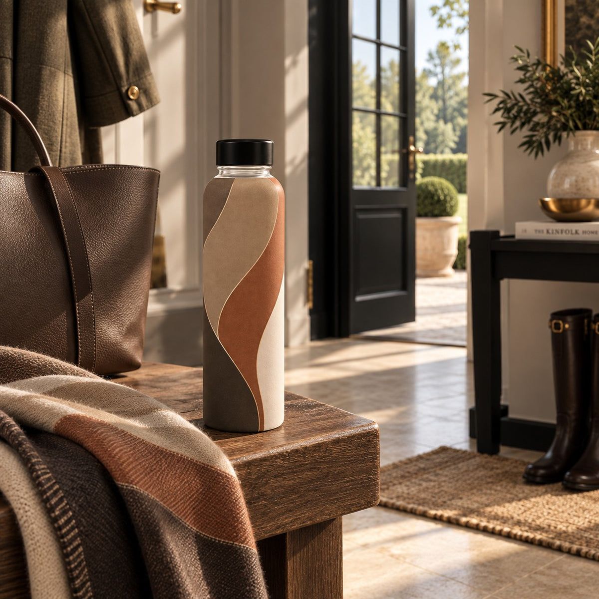 Estate Living Contour glass water bottle with sweeping espresso, warm taupe, terracotta and soft stone curves with fine gold detailing