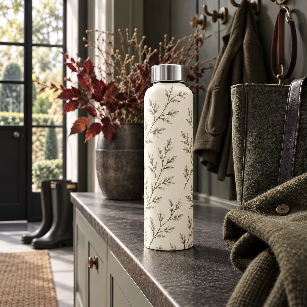 Reusable 500ml glass water bottle with green willow branch design and stainless steel lid from the A&W Signature Willow Collection
