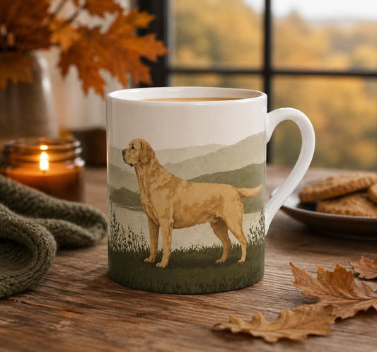 Golden Labrador fine bone china mug featuring an illustrated golden Labrador against a softly layered countryside landscape in natural tones