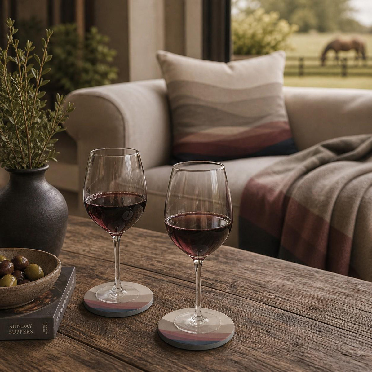 Estate Living Wave round ceramic coaster in ivory, taupe, burgundy and midnight blue with gloss finish